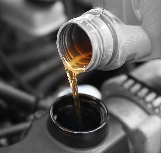 Car oil being poured