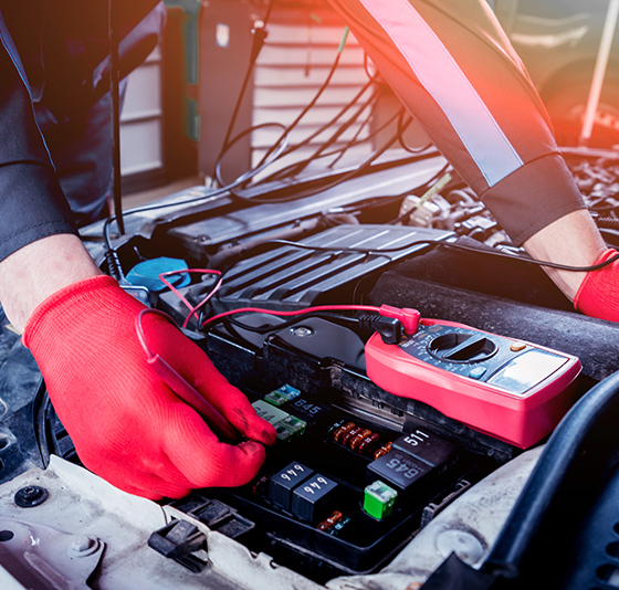 Hand of mechanic texting car electrical function