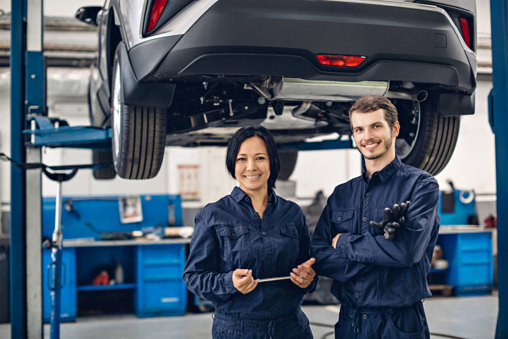 Two happy mechanic ready at your service