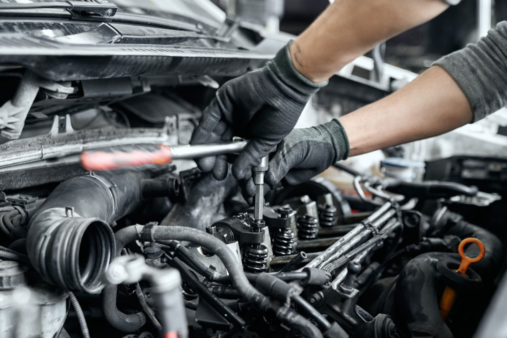 Mechanic working on engine repair