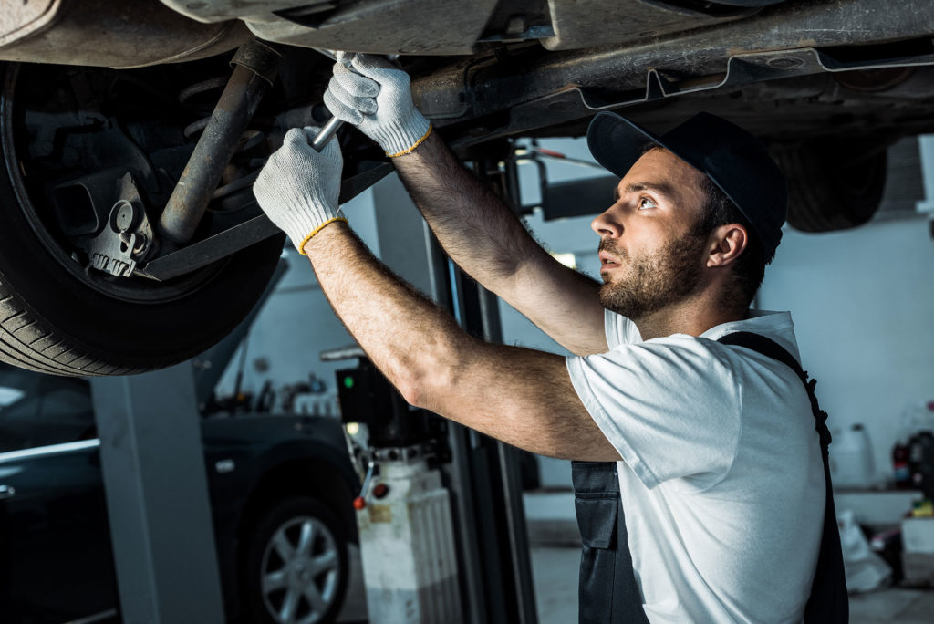 Mechanic working on suspension