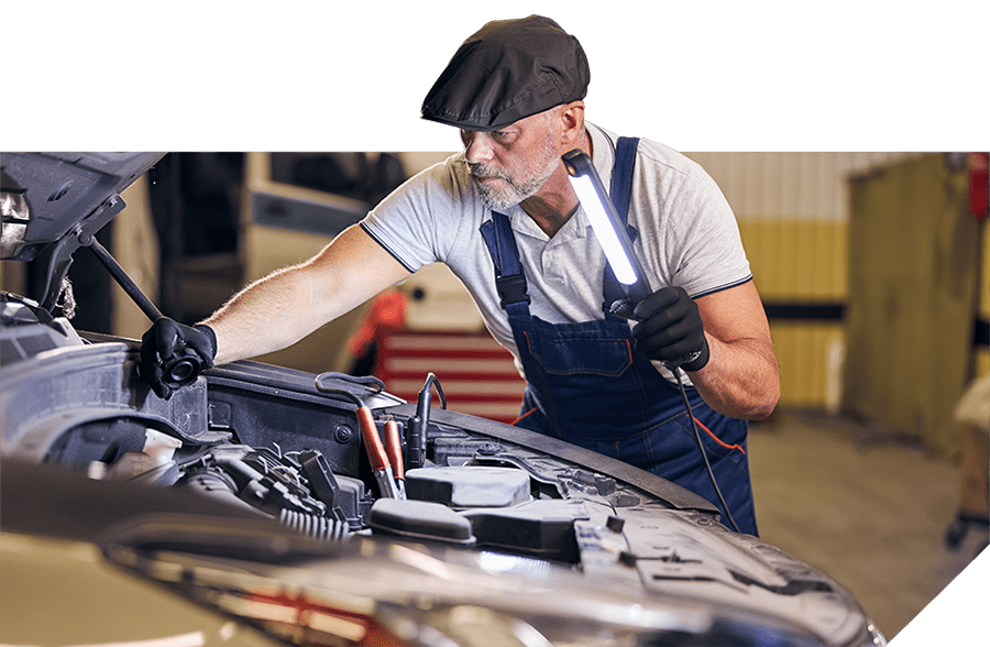 Mechanic inspecting a car engine