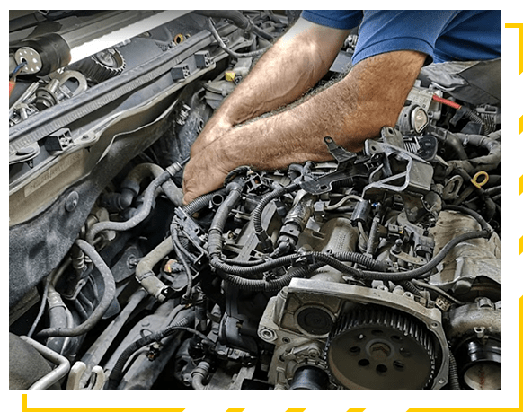 Mechanic fixing a car engine