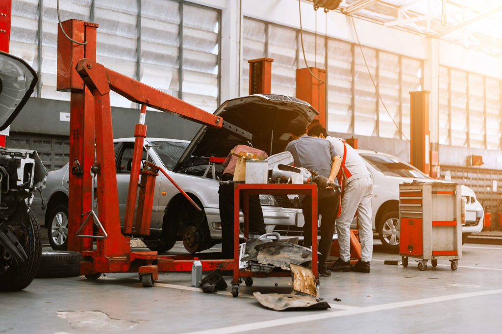 Interior of a car repair in garage service station with soft-focus and over light in the background