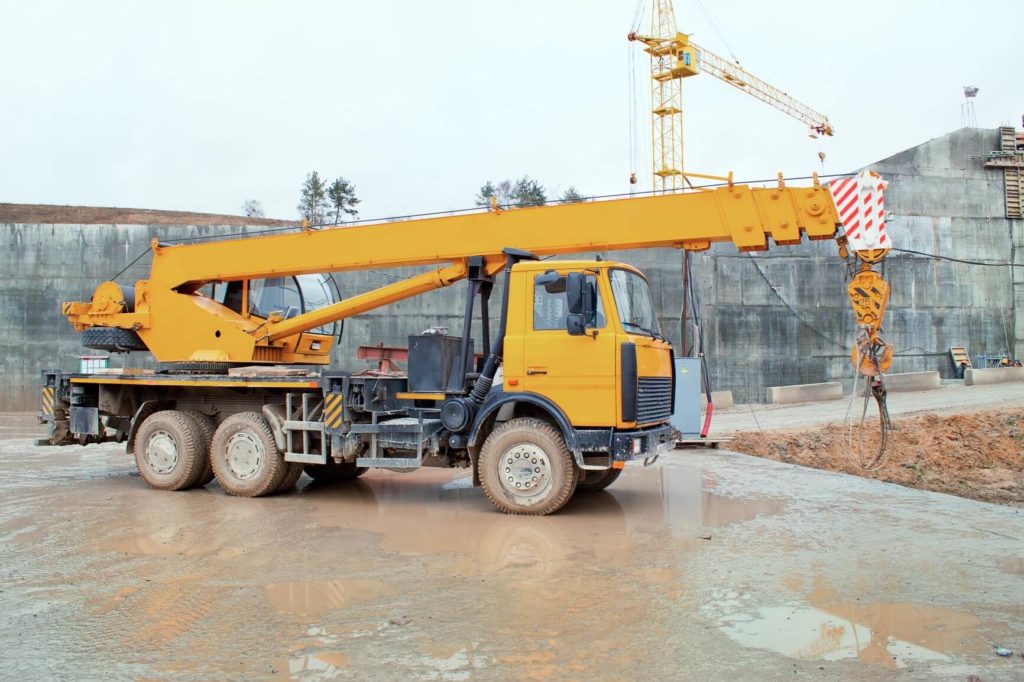 Truck crane standing on a construction site under construction hydropower plants in Grodno Belarus