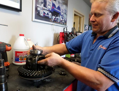 Mechanic fixing car gear