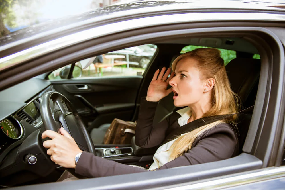 Woman driver upset in the Car crash, frustrated about traffic jam