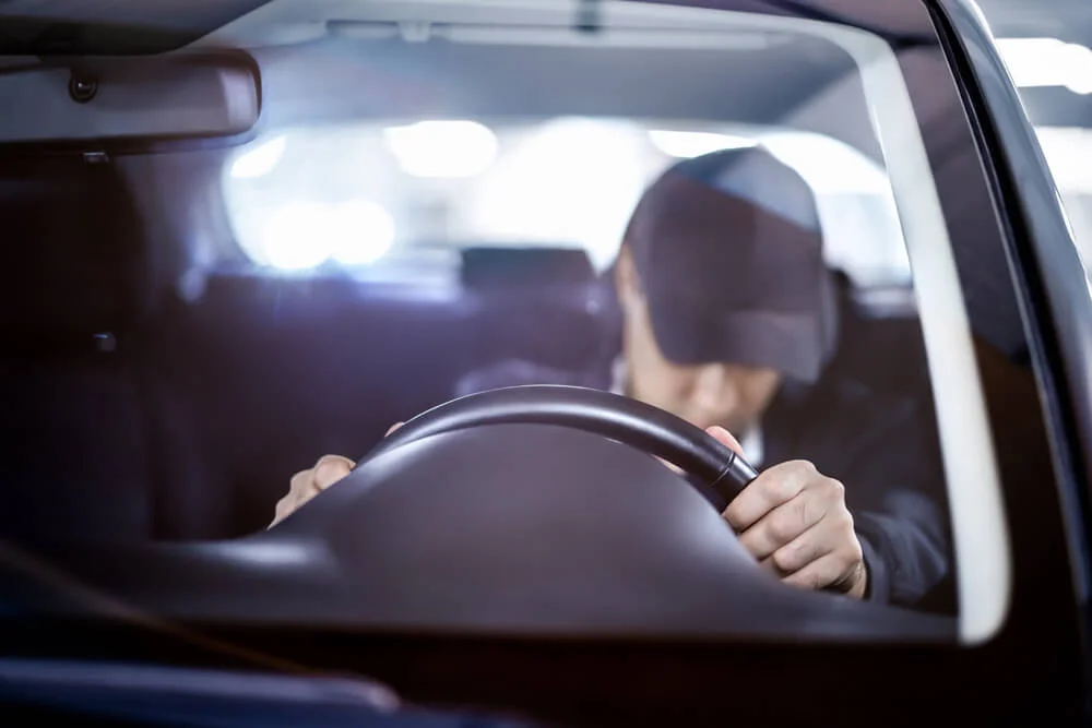 Tired and sleepy driver. Drowsy man driving car. Person sleeping in traffic