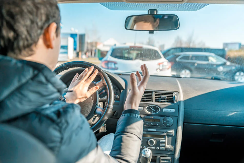 angry man, uses the car horn