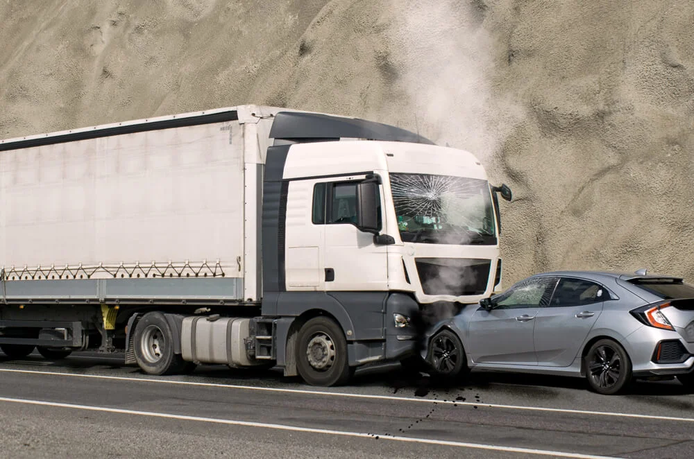 Accident between a truck and a car. Speed and carelessness on the street.