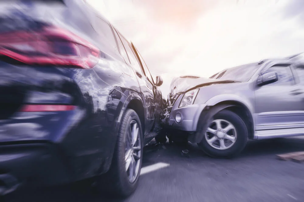Car crash dangerous accident on the road. SUV car crashing beside another one on the road with speed zoom blur