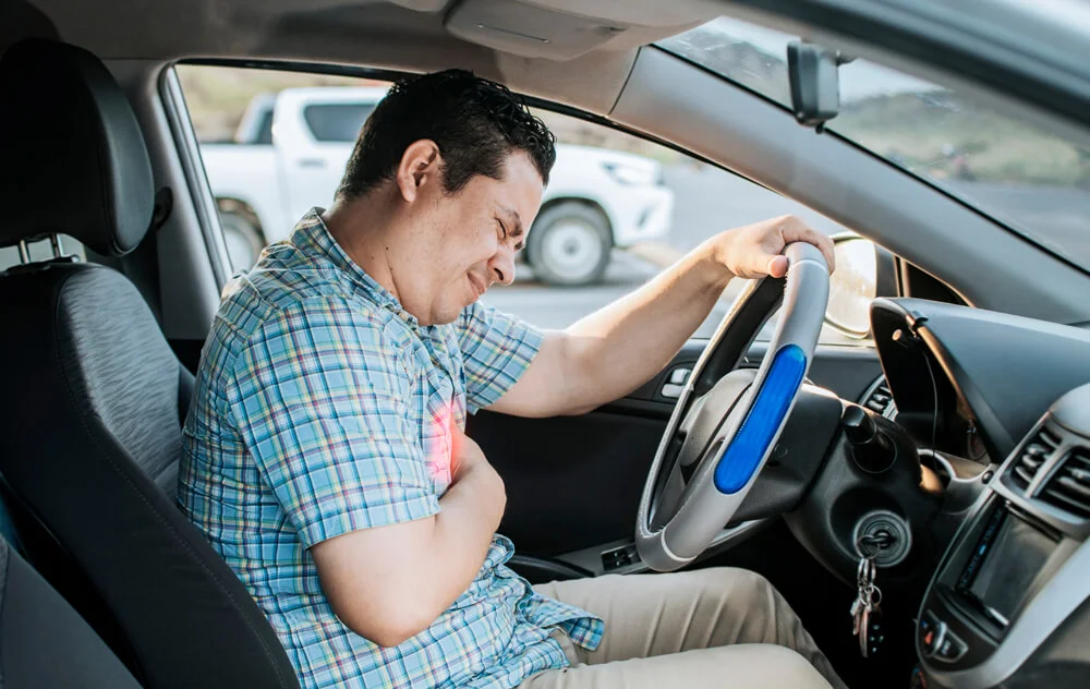 Person with heart attack while driving. Driver with chest pain. Driver's Heart Attack Concept, Suffering driver with chest pain