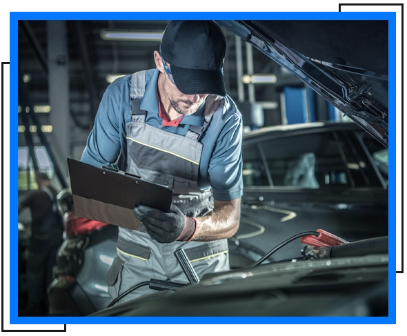 mechanic holding notes for car inspection