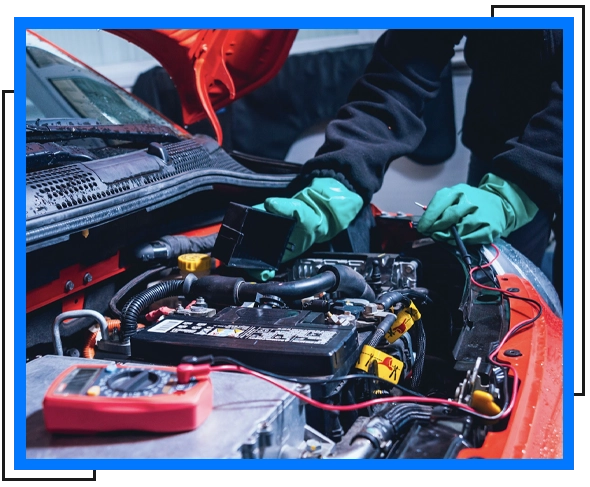 mechanic checking car battery