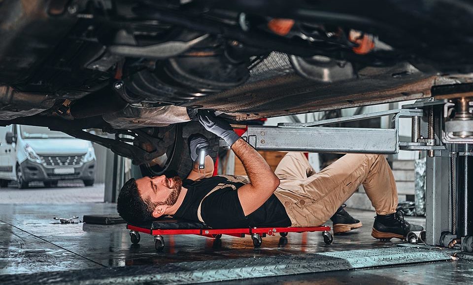 The mechanic holding wrench in hand for fix car