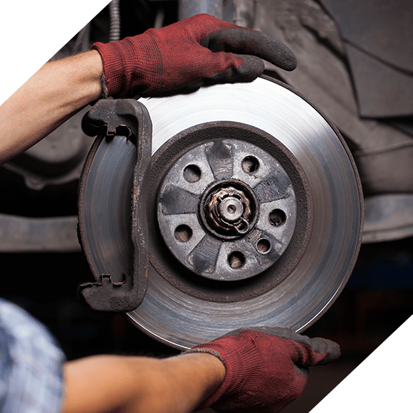 Mechanic holding car brakes