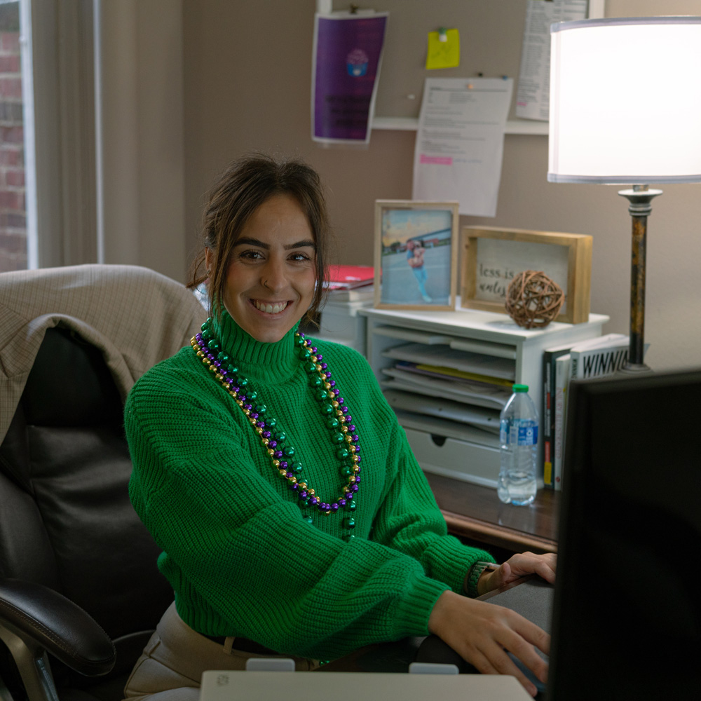 Woman sitting in front of a desk