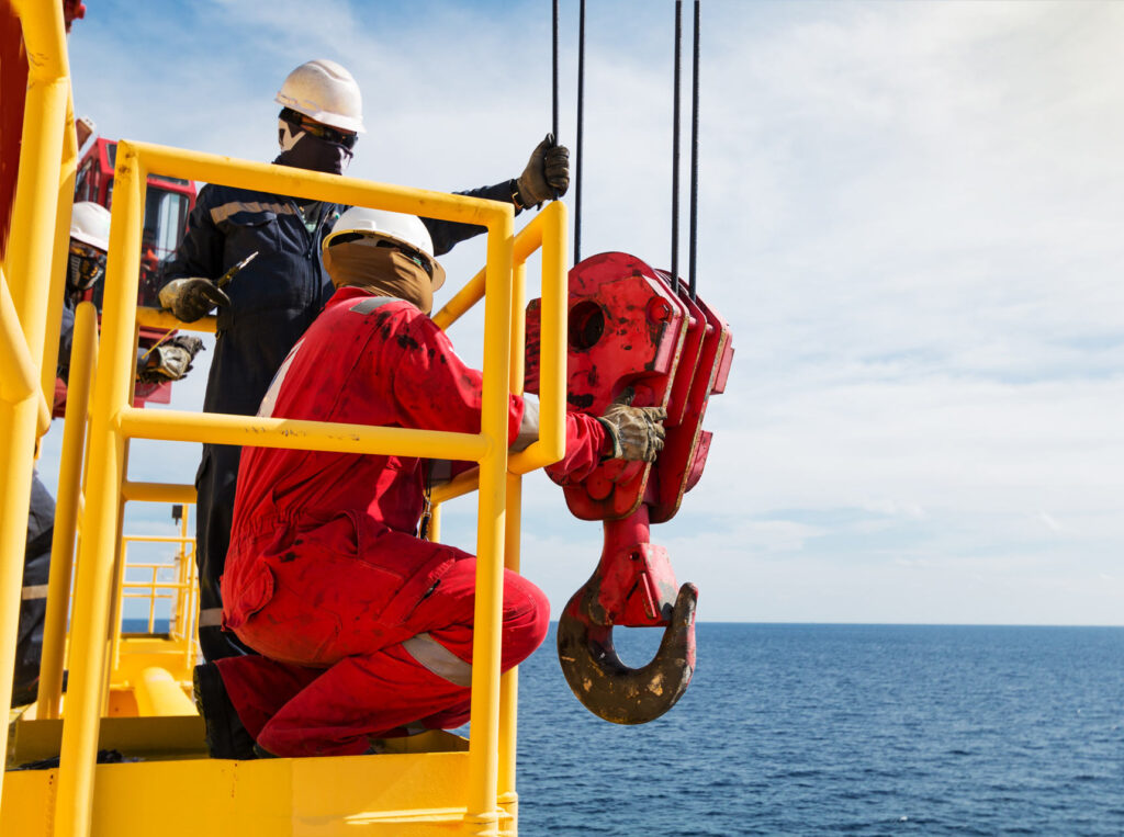 Crane inspector, crane inspector on the job inspect crane operation system, crane equipment and function pull load test by load cell calibrator