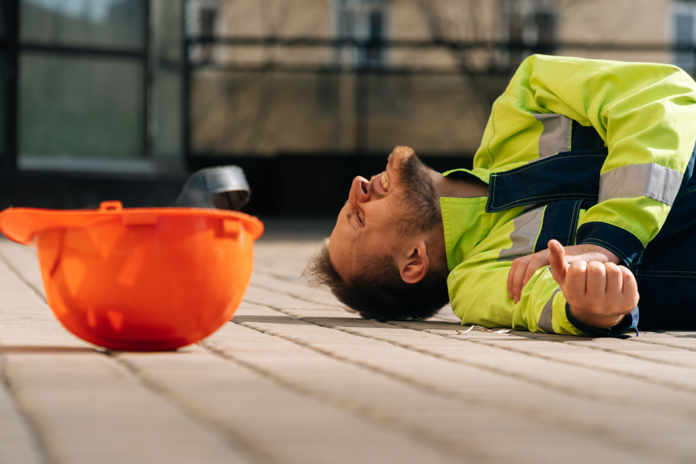The builder fell after a hand injury at the elbow.