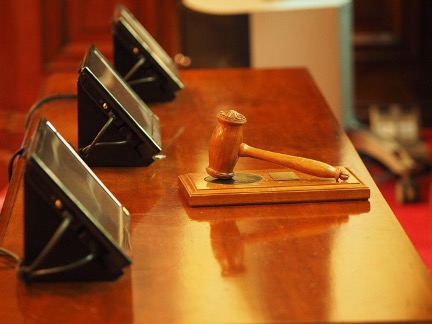 gavel sitting on top of desk in court room