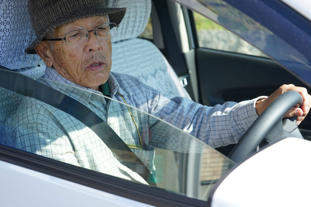 Senior person driving a car