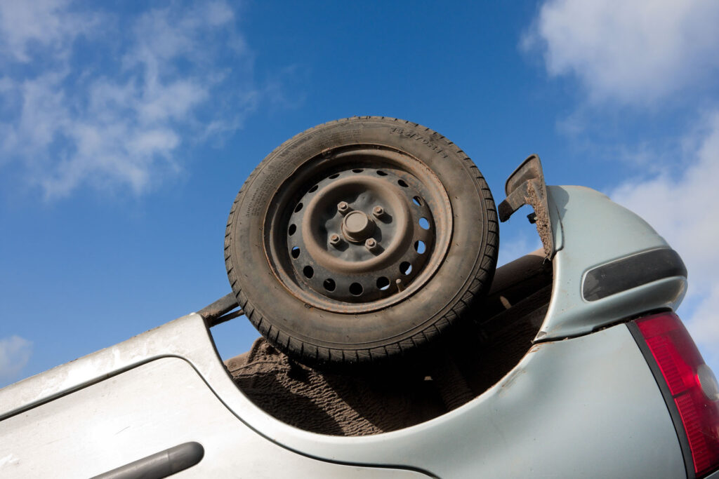 turned upside-down after road collision
