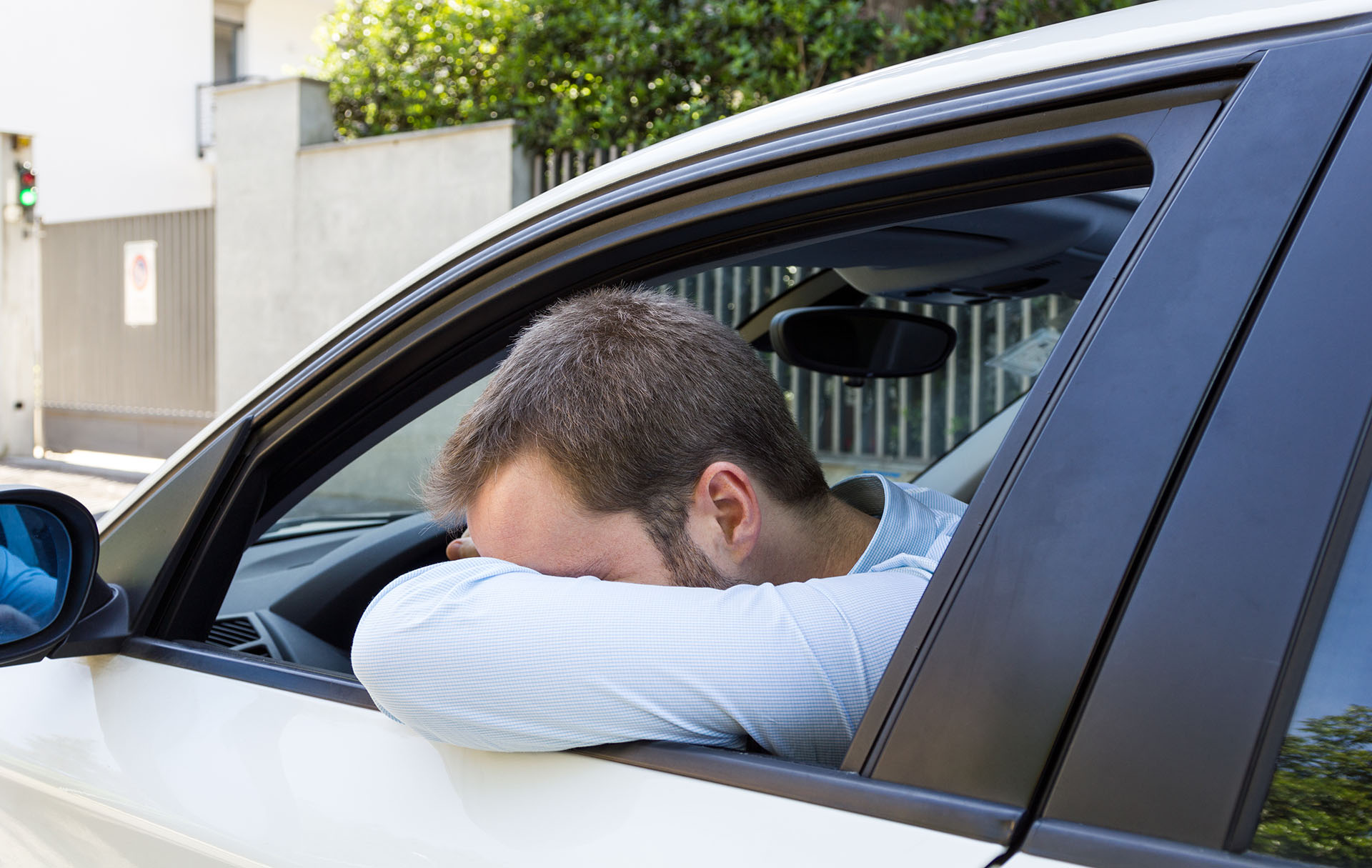 Desperate businessman driving his car
