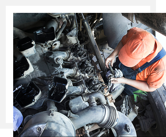 Man repairing diesel truck